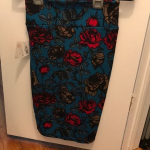 Floral LulaRoe Cassie with Teal background